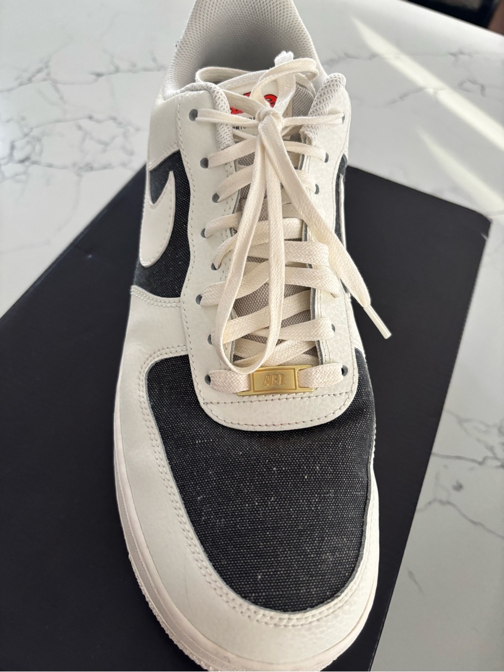 Nike Men’s Low-Top Sneakers in White and Black with Gold Accent